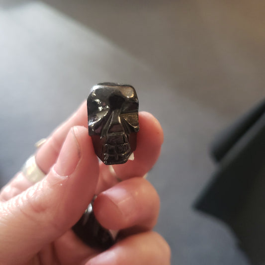 small obsidian skulls hand carved